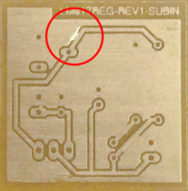 Multiple copper errors on a single PCB. Since the isolation is too low, copper pour is not completely etched off from the traces and it remains connected. The error inside the red circle is cut using a blade.